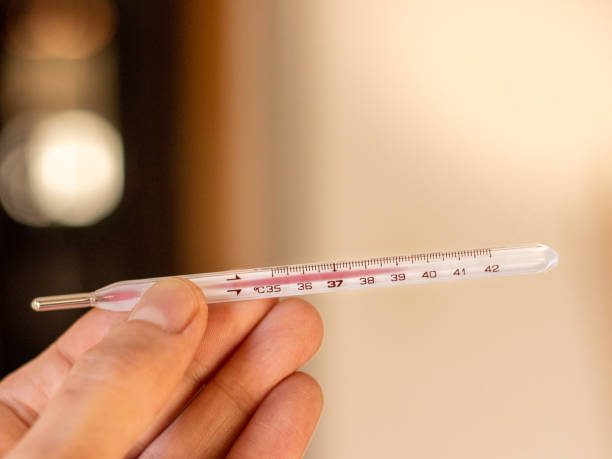 istock Old thermometer showed fever caused by coronavirus 1358436110