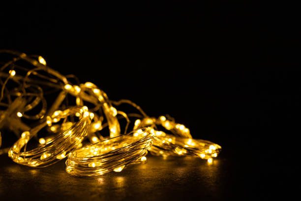 istock Golden LED-illumination on a black background 1358436934