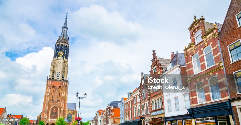 Nieuwe Kerk tower and traditional houses on Market square of old beautiful city Delft, Netherlands Architecture Stock Photo
