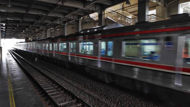 istock Train Commuter Line passing on a station 1358439440
