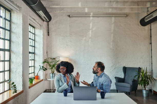 Diverse couple arguing while having online session with therapist Unhappy biracial couple having counsel session with marriage counselor at online session via laptop, they arguing during treatment couples online counseling stock pictures, royalty-free photos & images