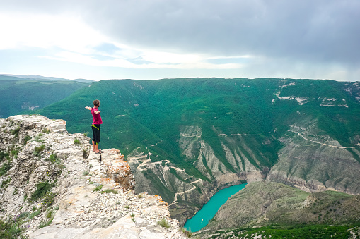 Traveler on a rock near the Sulak canyon in Dagestan