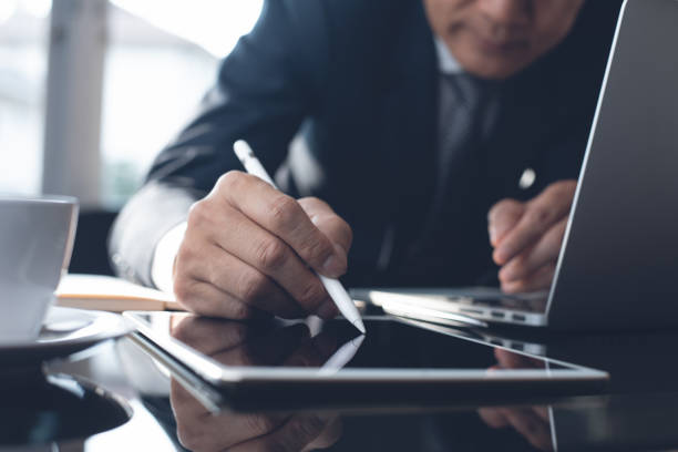 istock Businessman working in modern office 1358442365