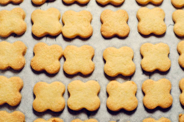 istock Christmas cookies on baking paper 1358443573