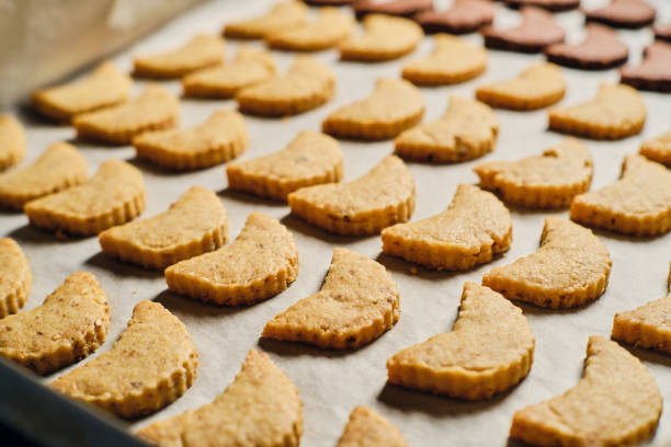 istock Christmas cookies on baking paper 1358443590