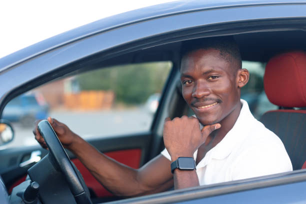 istock An African-American man driving a car. Human emotions 1358443792
