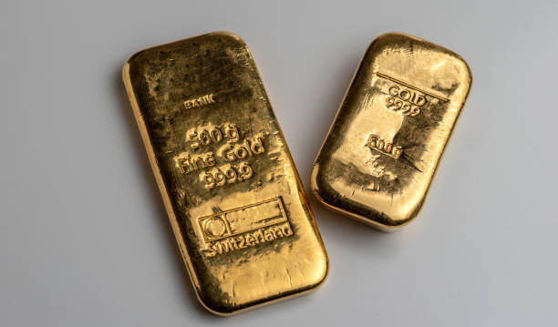 istock Two gold bars from different manufacturers weighing 500 grams each 1358444343