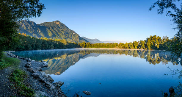 istock Sunrise at a idyllic lake 1358444538