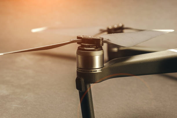 istock Quadrocopter close-up. Drone blades on a light background 1358446104