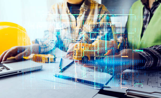 istock engineer working at a drawings of house in office for discussing. Engineering tools and construction concept. 1358446531