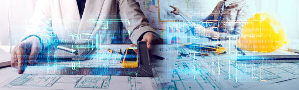 istock engineer working at a drawings of house in office for discussing. Engineering tools and construction concept. 1358446533