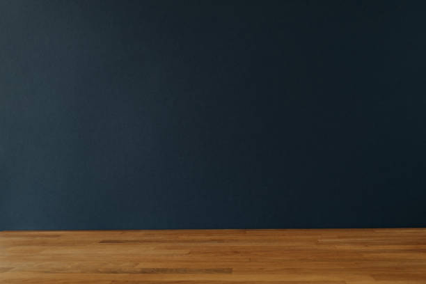 istock Dark blue background for copy space and wooden table 1358448728