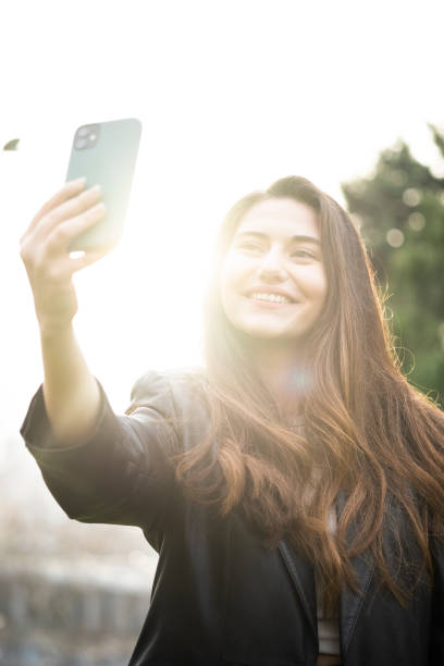 istock Young beautiful girl taking selfie 1358450718
