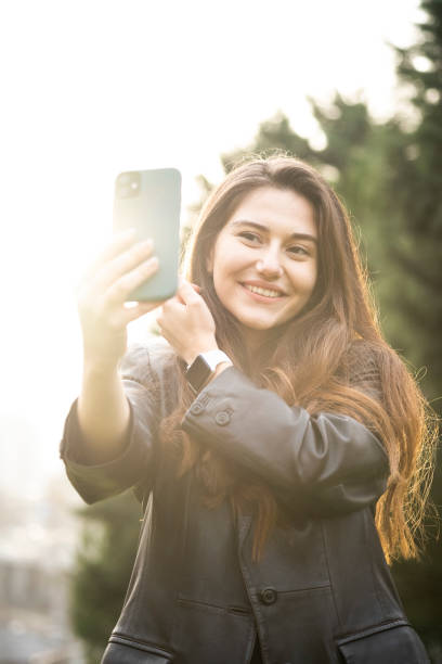 istock Young beautiful girl taking selfie 1358451283