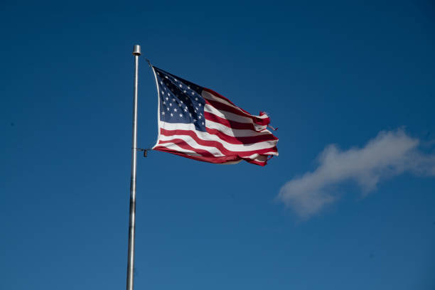 istock United States flag waving in the wind 1358457042