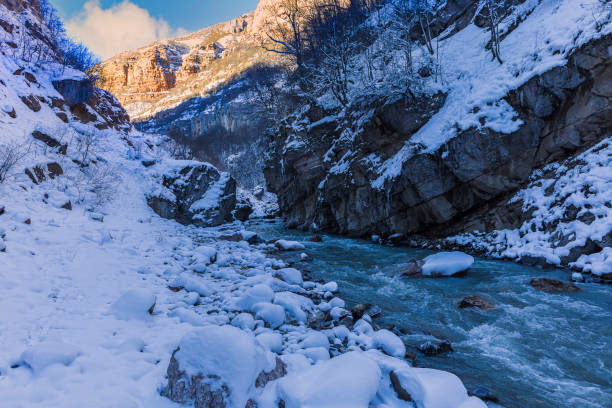 istock Mountain river flowing in the gorge in winter 1358457450