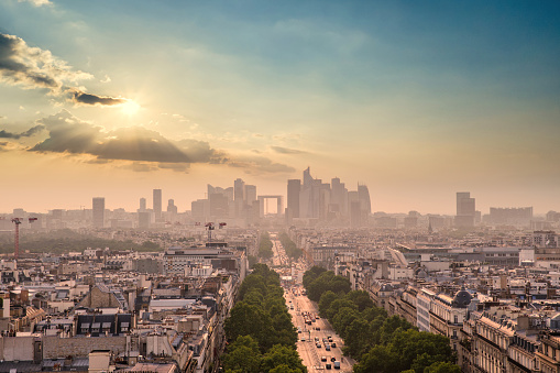 La Defense district in downtown Paris at sunset viewed from the Arc de Triomphe.