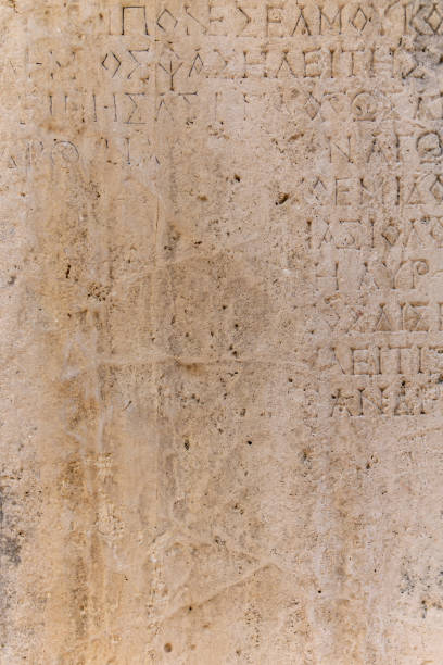 Phaselis, Turkey - November 08, 2021: ancient Greek inscription on the stone almost erased from time