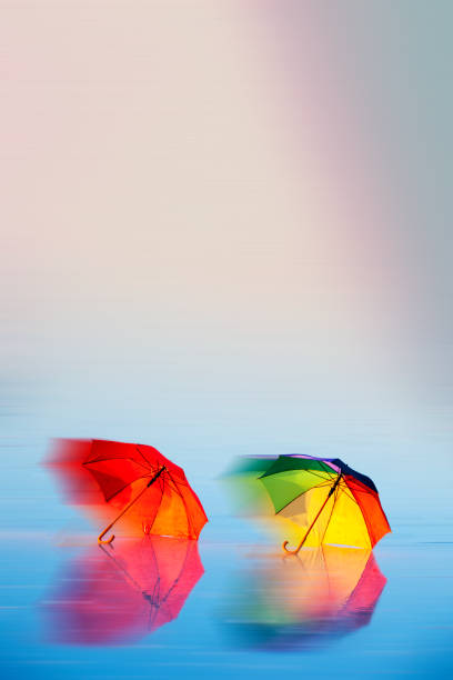 istock Colorful umbrellas on the water 1358465674