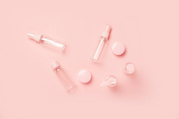 istock Empty tubes for cosmetics on a pastel pink background. Flat lay, top view. Banner 1358466532