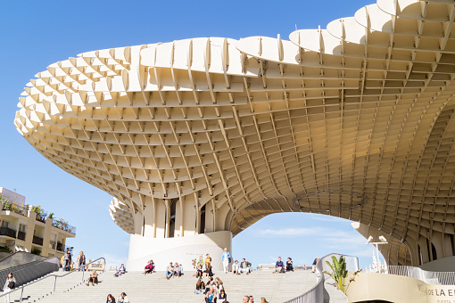 Seville, Andalusia, Spain; November 7th 2021: View from below of the architectural structure called Metropol Parasol or Las Setas. Modern urban viewpoint in the shape of a mushroom.