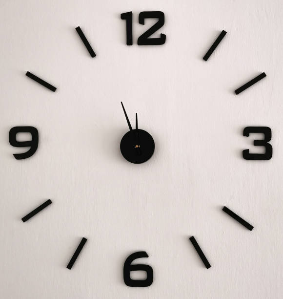 istock Big clock showing five minutes to midnight 1358469339