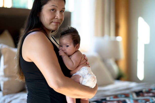 istock Holding Baby Closely 1358470178
