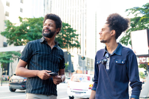 istock Two friends at Paulista Avenue 1358470434