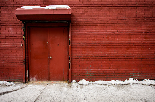 Red brick wall and door background in New York