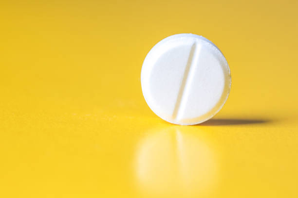 istock A large white tablet on a yellow background 1358473912
