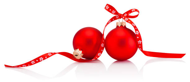 istock Two Christmas red bauble with ribbon bow isolated on white background 1358477863