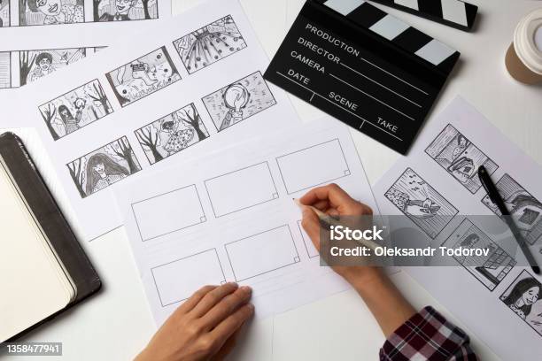 The Artist Draws A Storyboard For The Film The Director Creates The Storytelling By Sketching Footage Of The Script On Paper Stock Photo - Download Image Now
