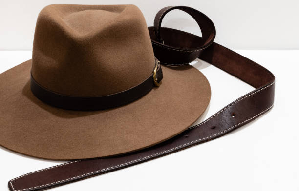 istock Classic cowboy brown felt hat and leather belt 1358478724