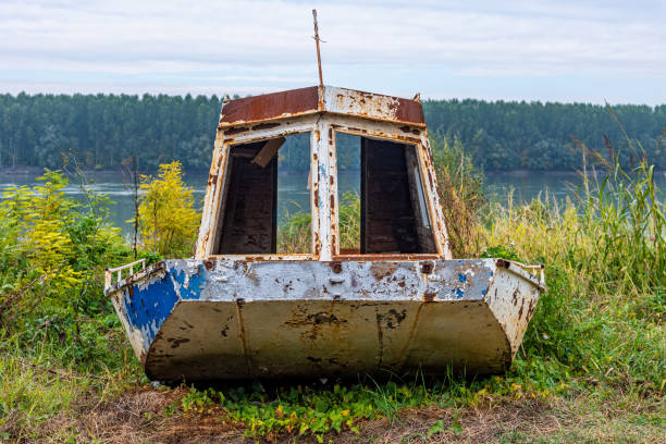 istock Old abandoned fishing boat on the shore 1358478826