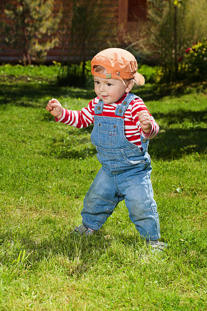 istock Toddler make first steps in the garden 135847931