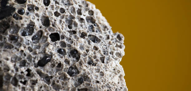 Meteorite rock detail, with light brown background