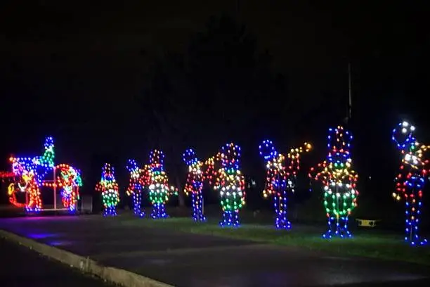 Photo of Drive through outdoor holiday lights music band