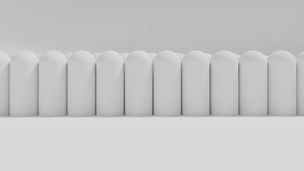 istock Line of White Capsules Background Low Angle Side Edge 1358487404
