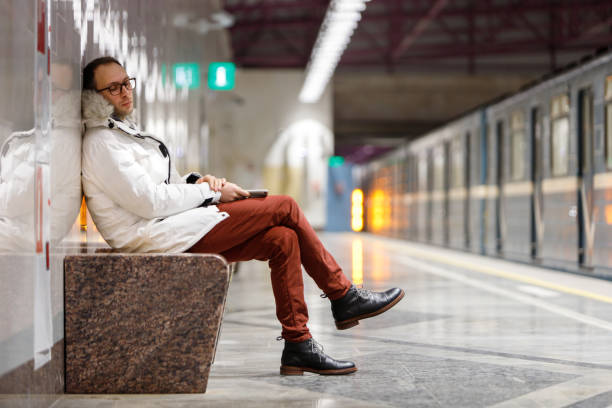 istock Crying man with feels unhappy and depressed sitting on bench 1358489040