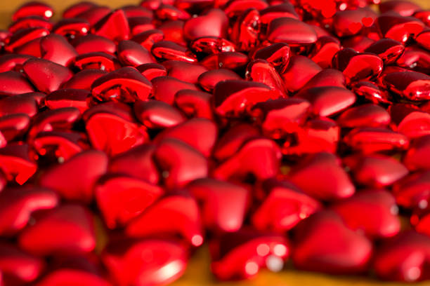 istock Valentine hearts scattered over table.  Great Background image. 1358489308