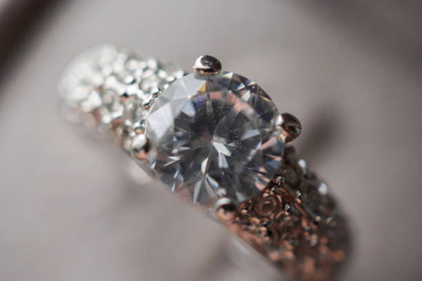 istock Diamond ring in jewelry gift box close up background 1358491942
