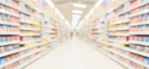 istock supermarket store aisle interior abstract blurred background 1358492042