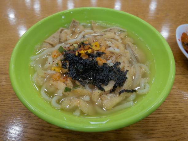 istock Udon with tofu in a light green bowl 1358492548