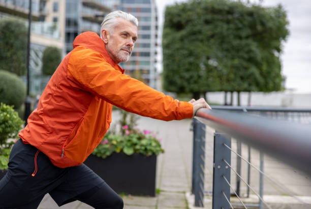 istock Fit man stretching outdoors before going for a run outdoors 1358492908