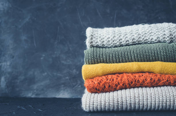 istock Pile of knitted woolen sweaters 1358493480