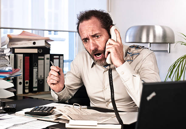 istock Furious Businessman on the phone 135849600