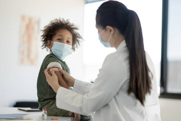 istock Getting a Bandage After a Vaccine 1358496304