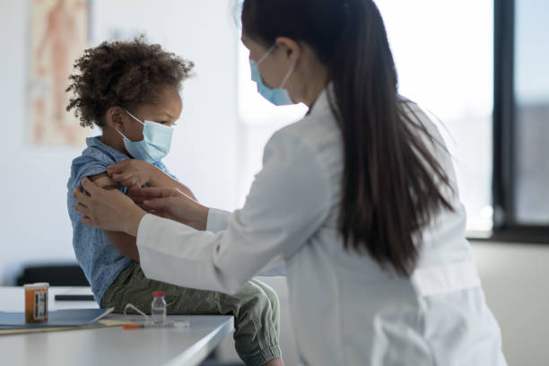 istock Getting a Bandage After a Vaccine 1358496307