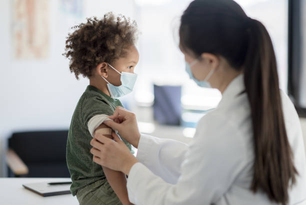 istock Getting a Bandage After a Vaccine 1358496308