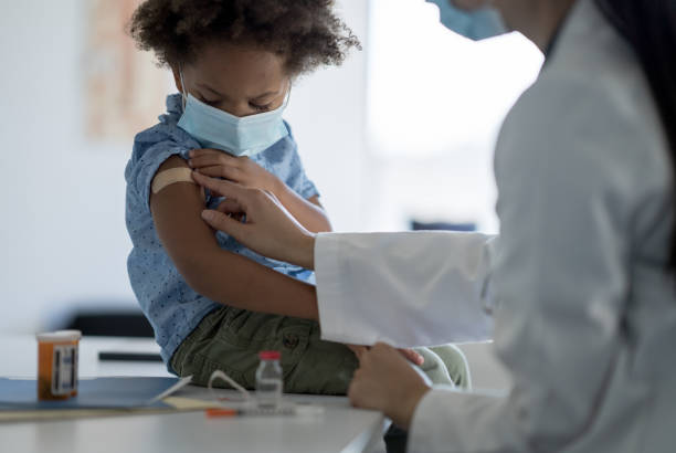 istock Getting a Bandage After a Vaccine 1358496310